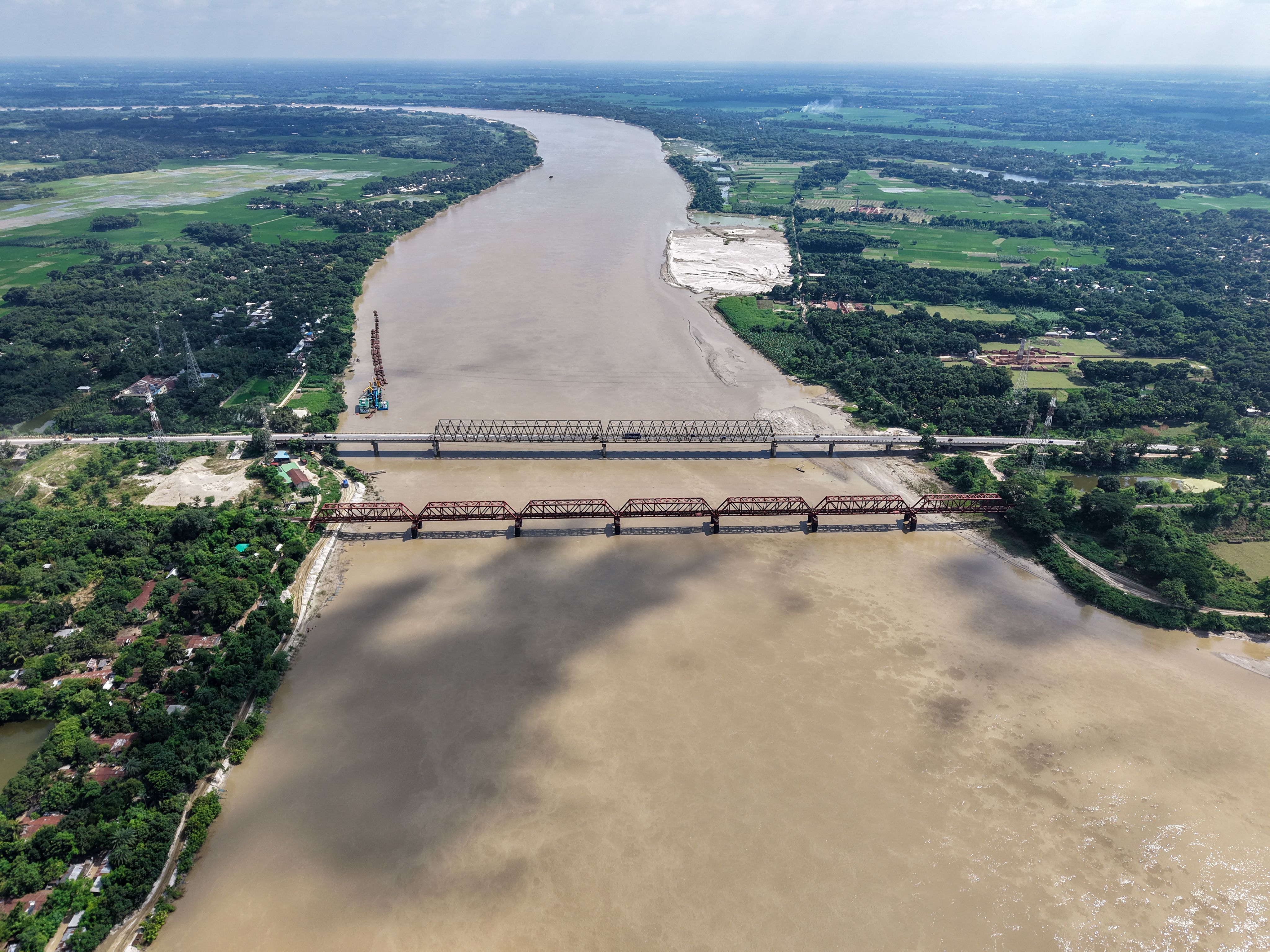 Stunning aerial image of Paksey Bridge stretching over a river in rural Bangladesh.
