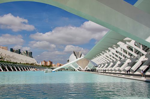 Free Modern architectural marvel, City of Arts and Sciences, with reflective pool under blue skies in Valencia, Spain. Stock Photo