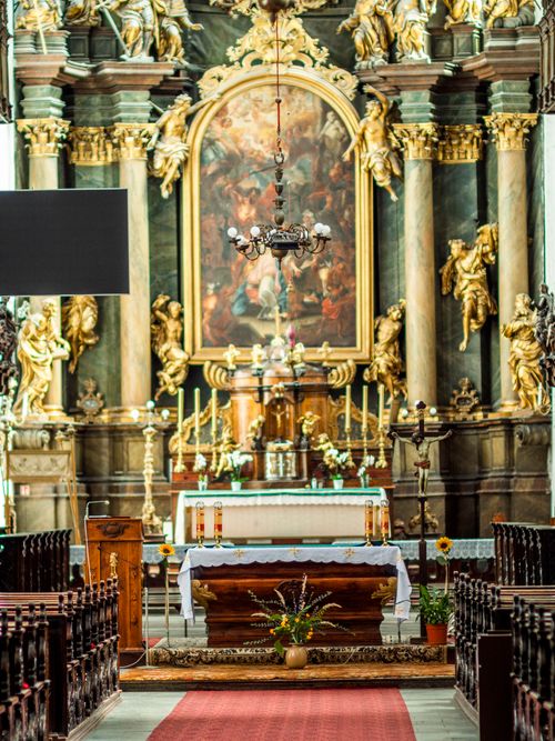 Free Stunning interior view of a Baroque church with intricate altar and decorations. Stock Photo