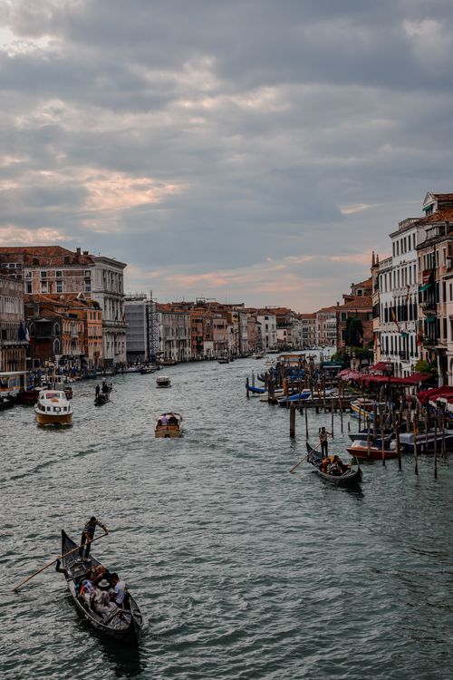 Free Capture of the vibrant life on the Grand Canal in Venice, featuring gondolas and historic architecture. Stock Photo