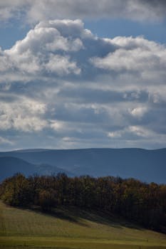 Beautiful landscape of Visegrád's hills under a dramatic cloudy sky, capturing nature's serene beauty.