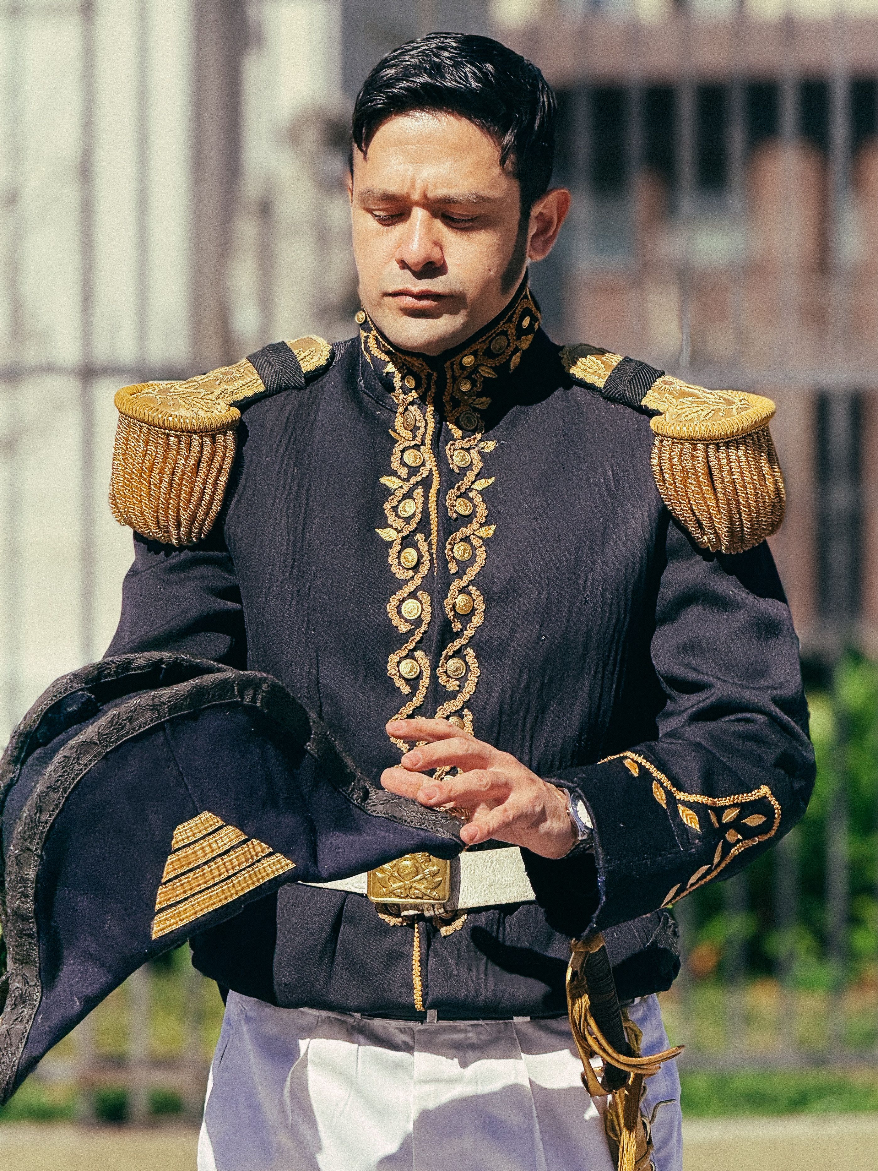 Man in ornate historic military uniform outdoors in Buenos Aires.