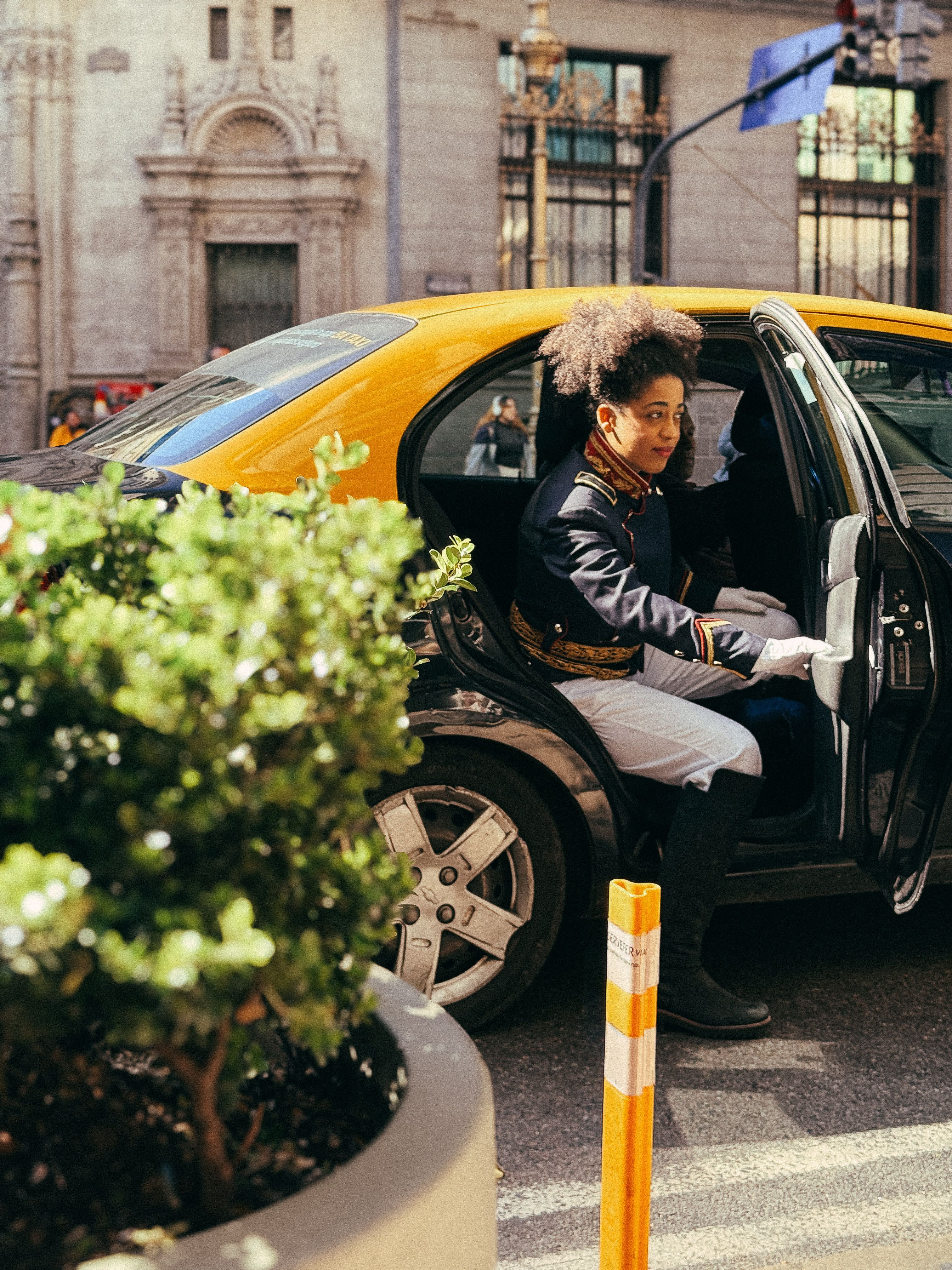 Elegant Doorman Exiting Vintage Taxi in Buenos Aires · Free Stock Photo