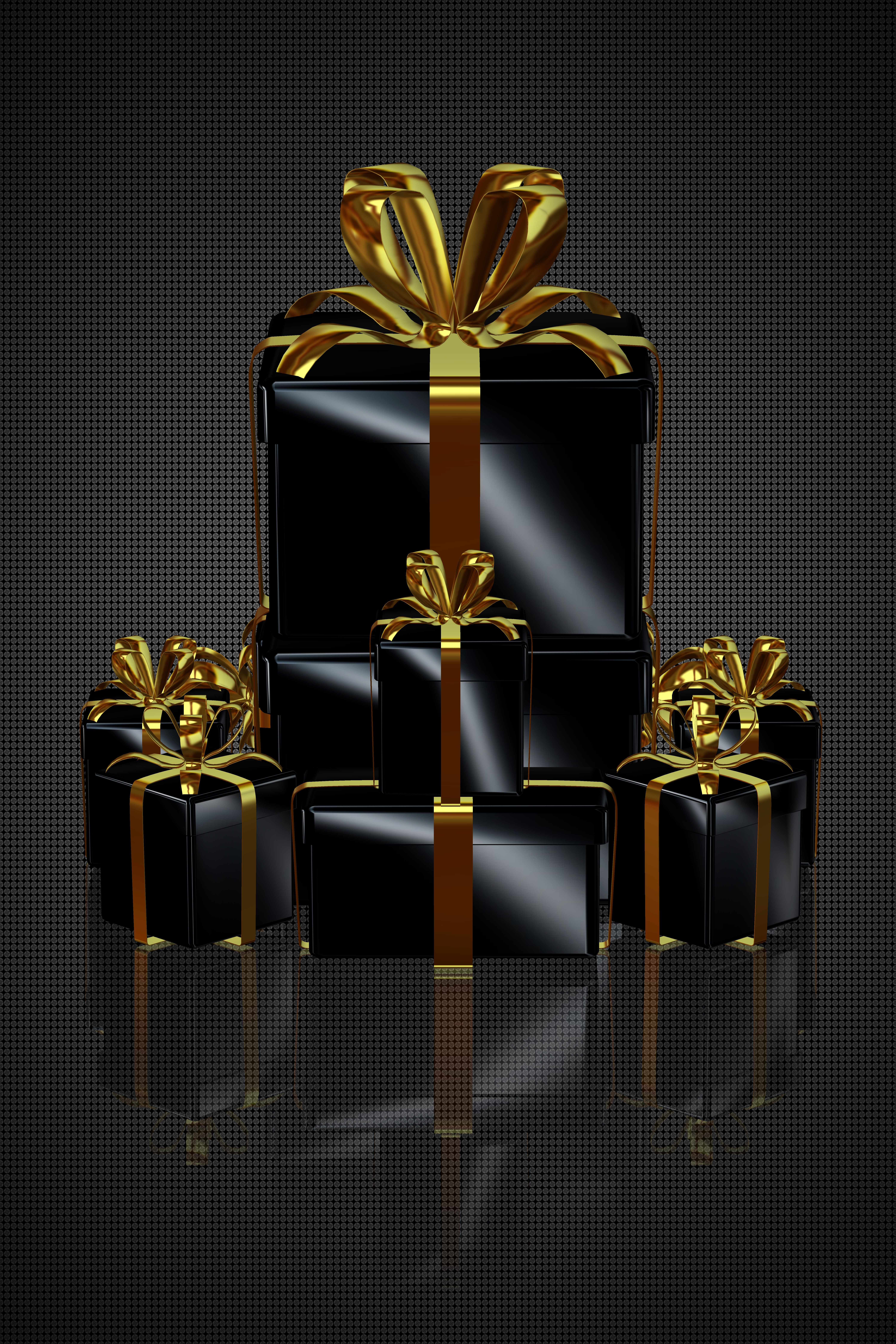 Luxurious black gift boxes adorned with gold ribbons, perfect for upscale celebrations.