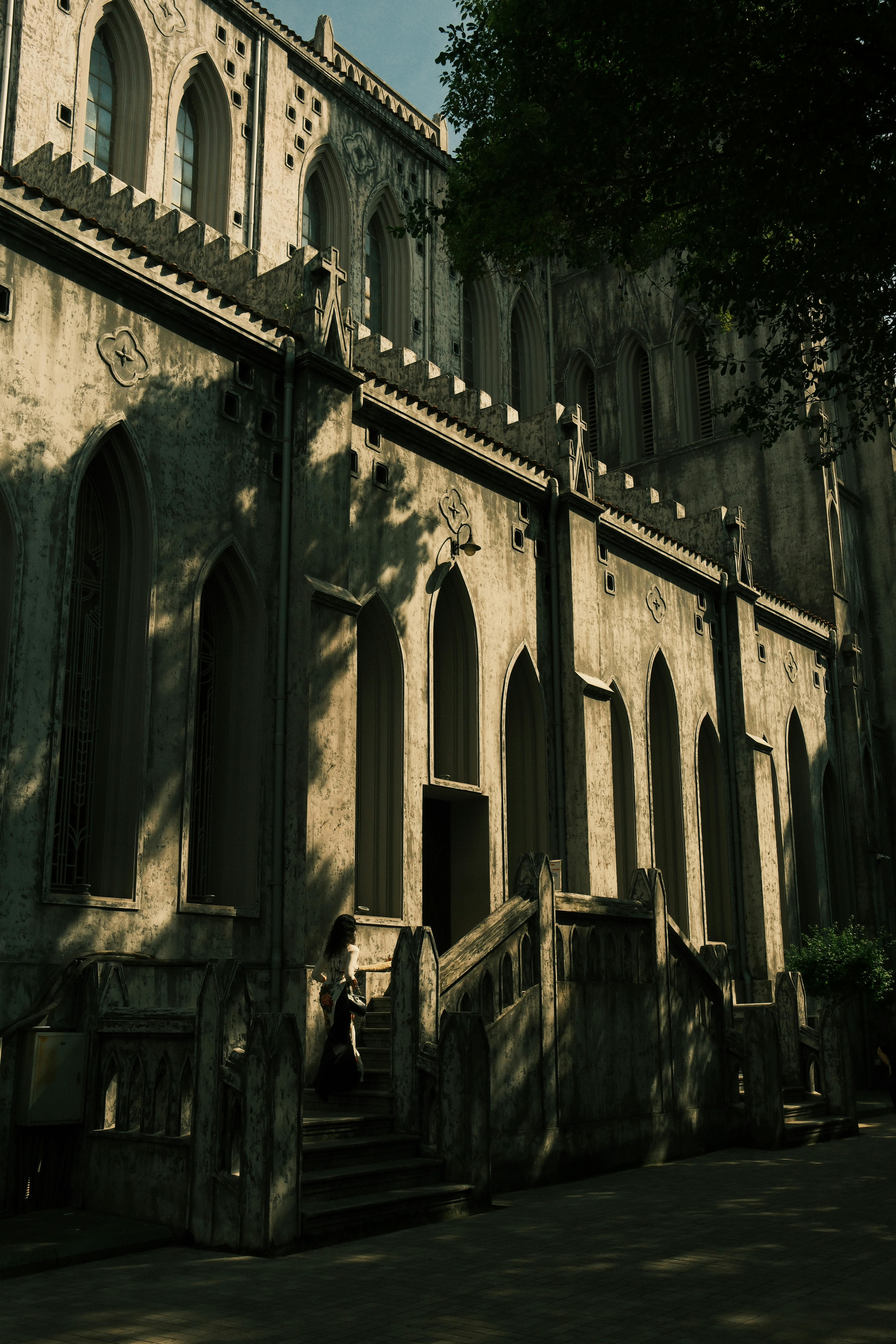 Stunning shadow play on the facade of St. Joseph's Cathedral in Hanoi, showcasing Gothic revival style.