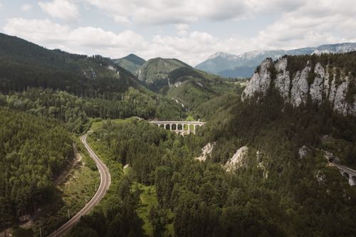 Free Stunning aerial view of alpine viaduct and lush forests in Austria. Stock Photo