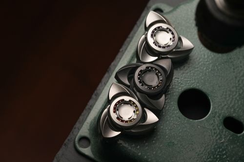 Free High-quality image of precision-engineered metal tool components showcased on a textured surface. Stock Photo