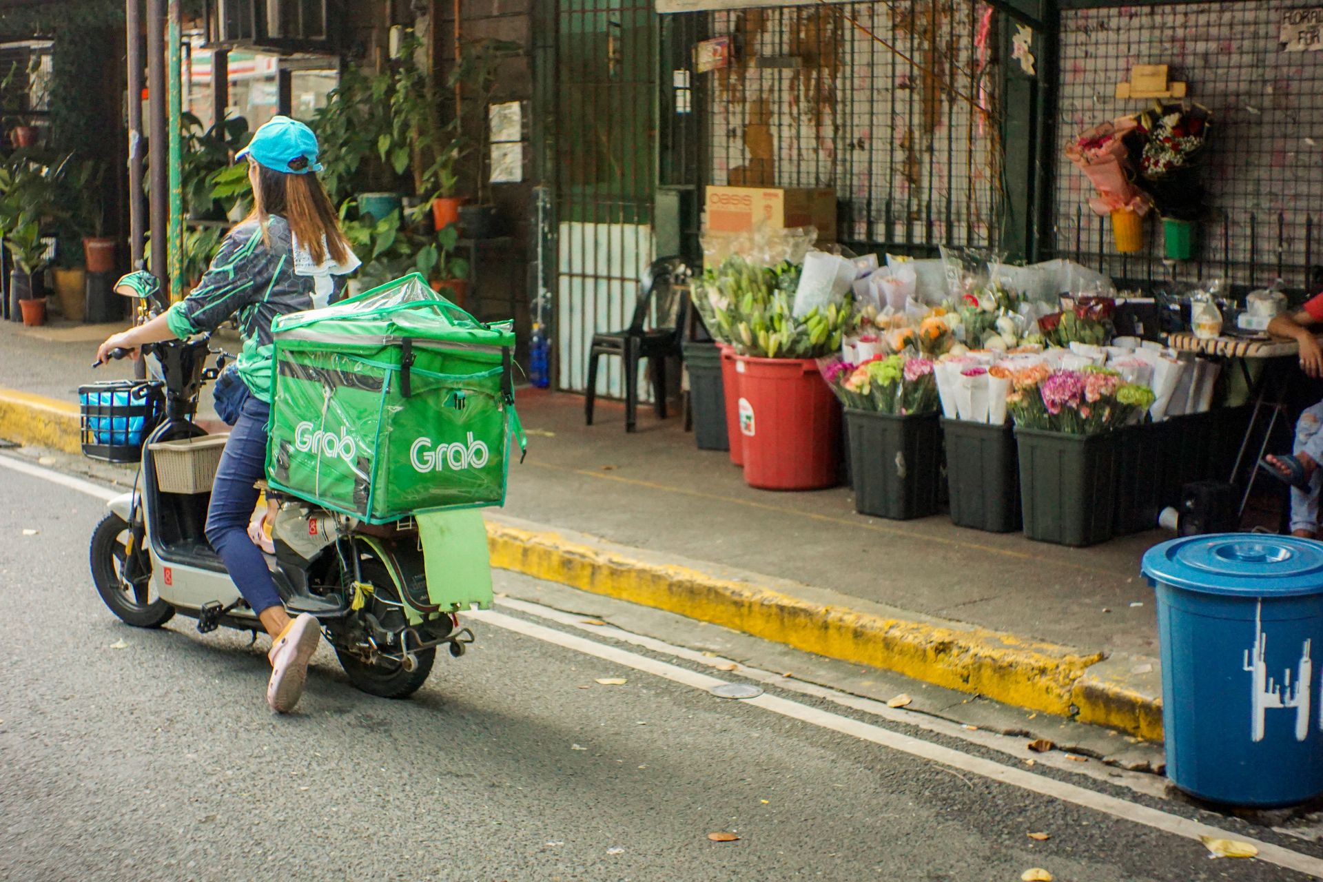 Grab delivery rider with food order in Singapore