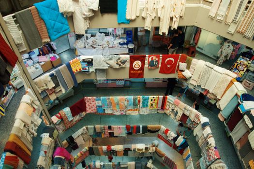 Vibrant textile market with colorful fabrics in Denizli, Türkiye, showcasing diverse patterns and textures.