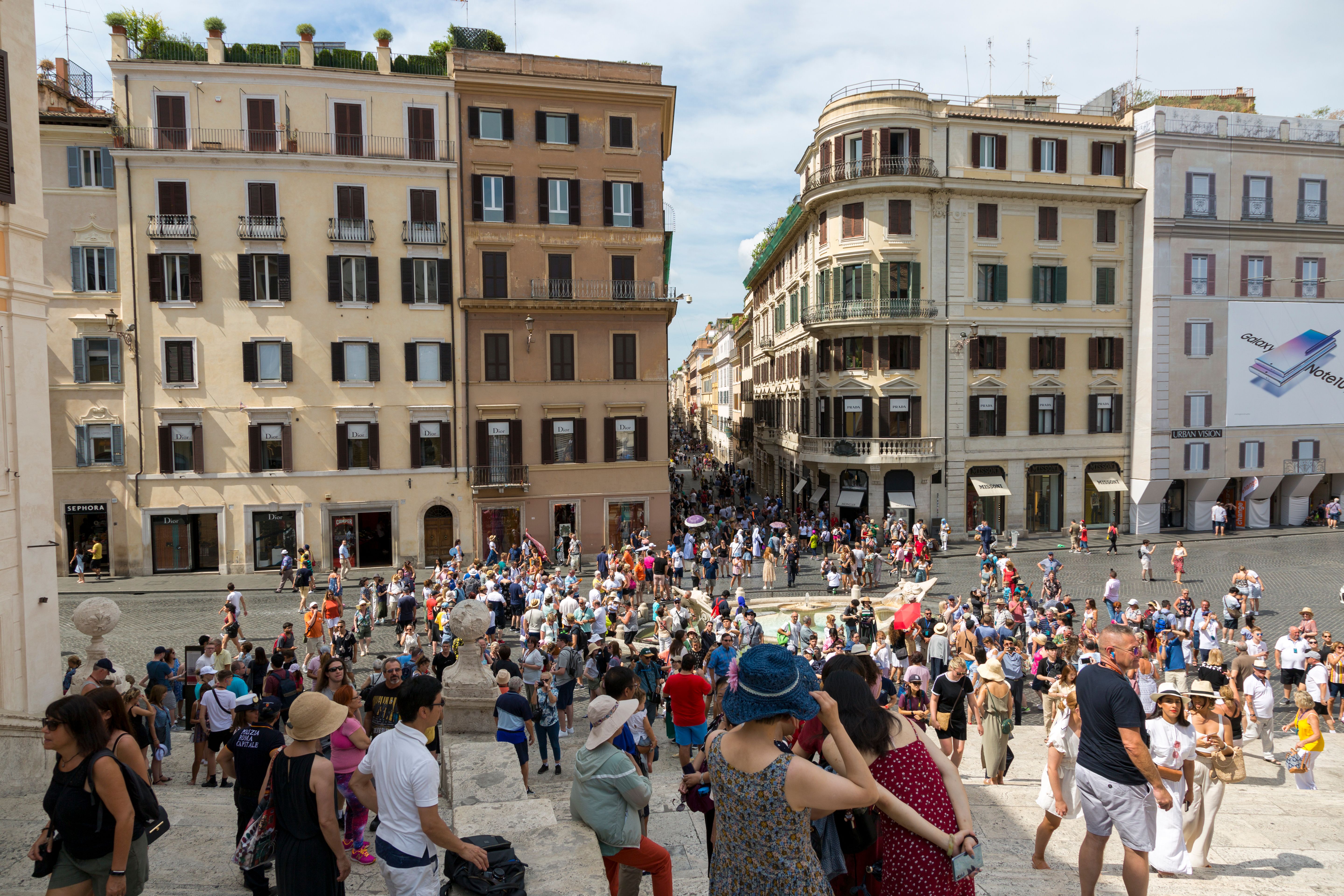 High-angle view of a crowded plaza by the Spanish Steps in Rome.