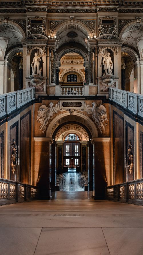 Free Luxurious Baroque staircase featuring ornate sculptures and architectural splendor. Stock Photo