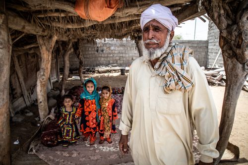 Free A family portrait showcasing traditional attire and lifestyle in Chabahar, Iran. Stock Photo