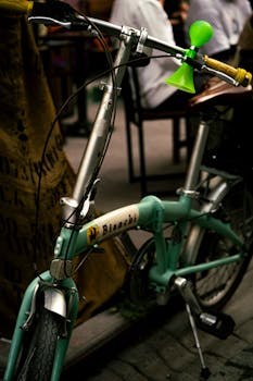 Close-up of a vintage Bianchi bike with colorful horn, captured on a street in Eskişehir, Türkiye.