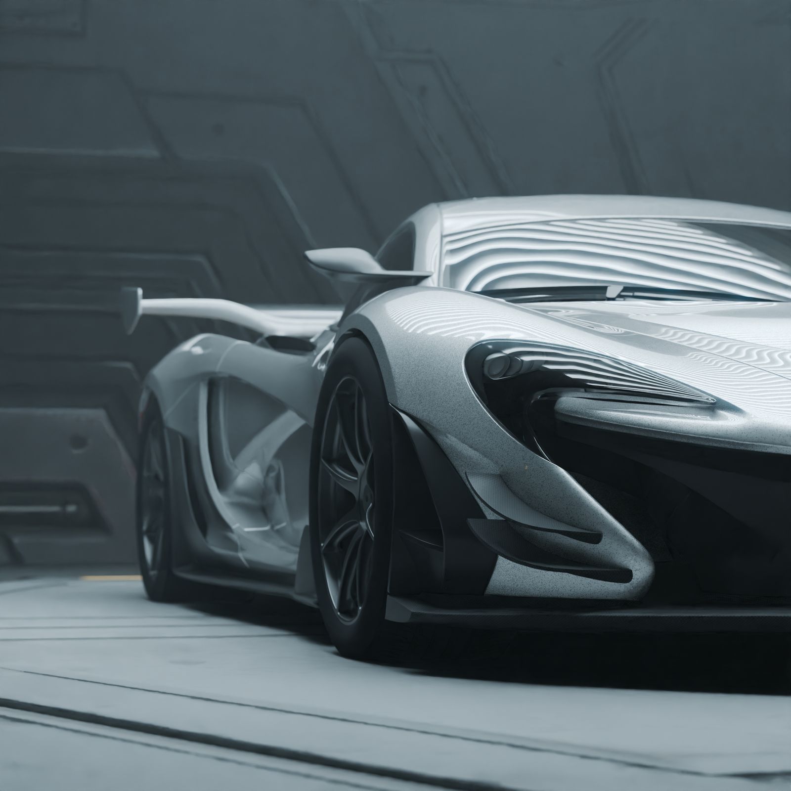 Silver sports car in a modern showroom