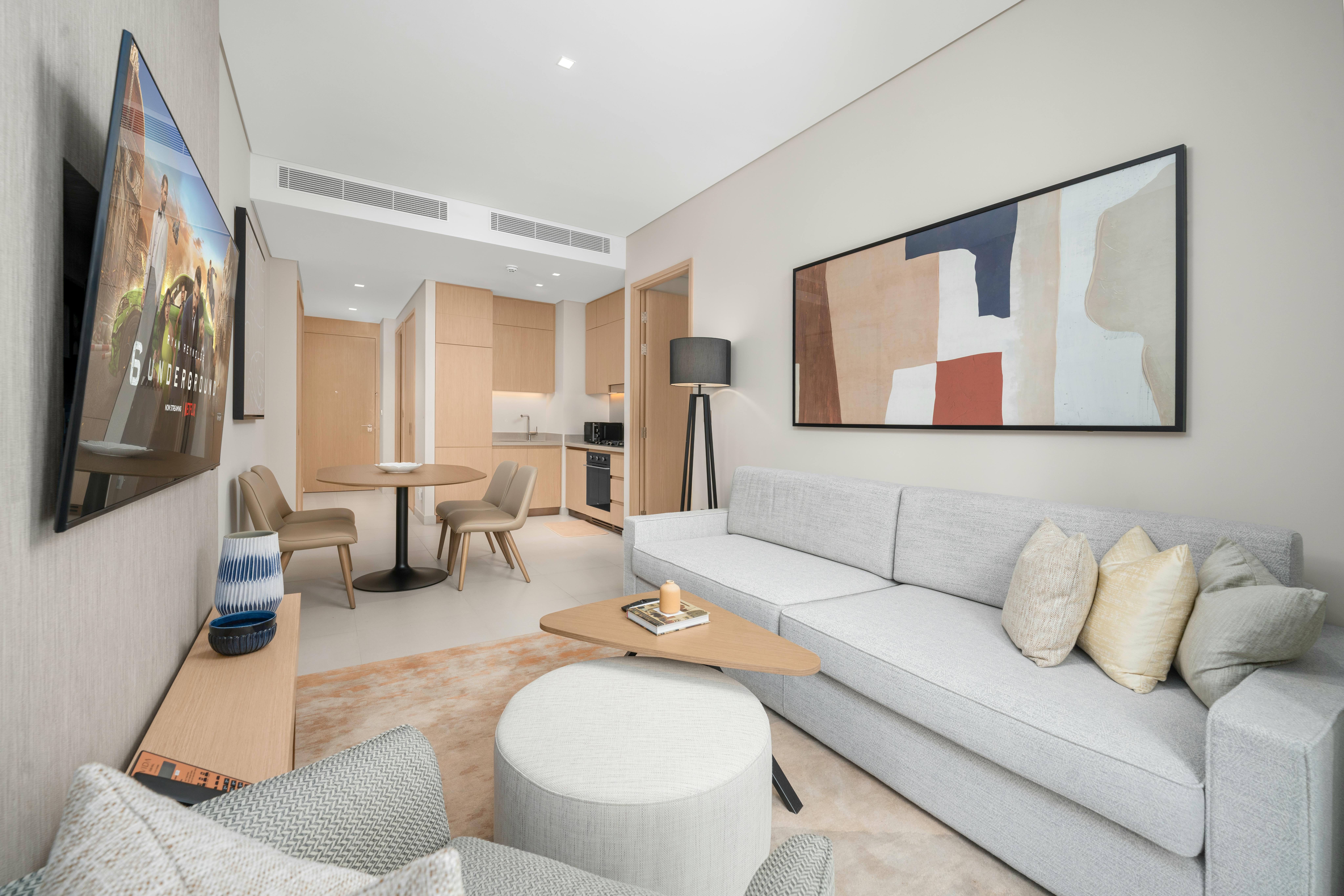 Bright and modern living space with open kitchen, elegant de