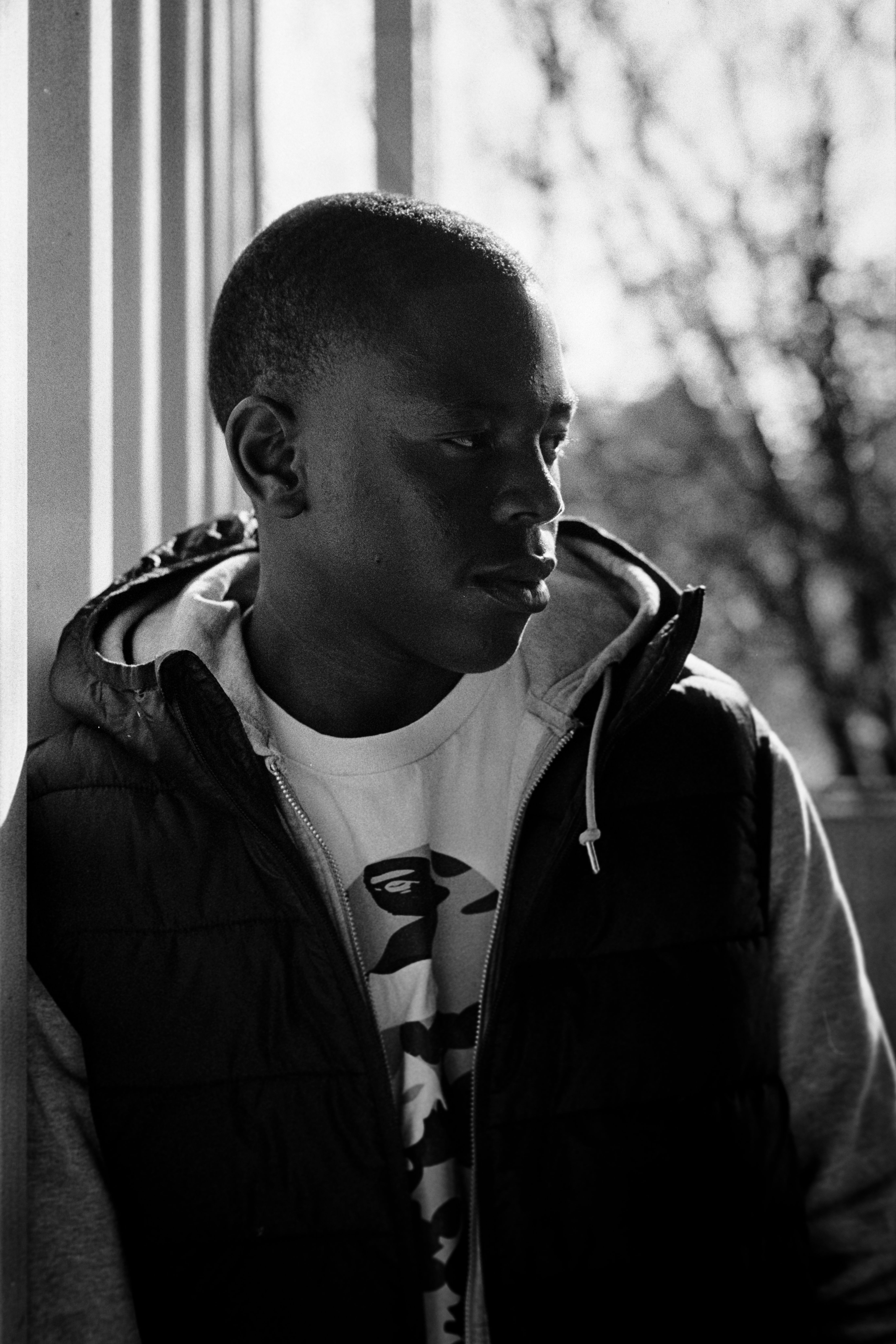 Artistic black and white portrait of a young man in Johannesburg, South Africa.