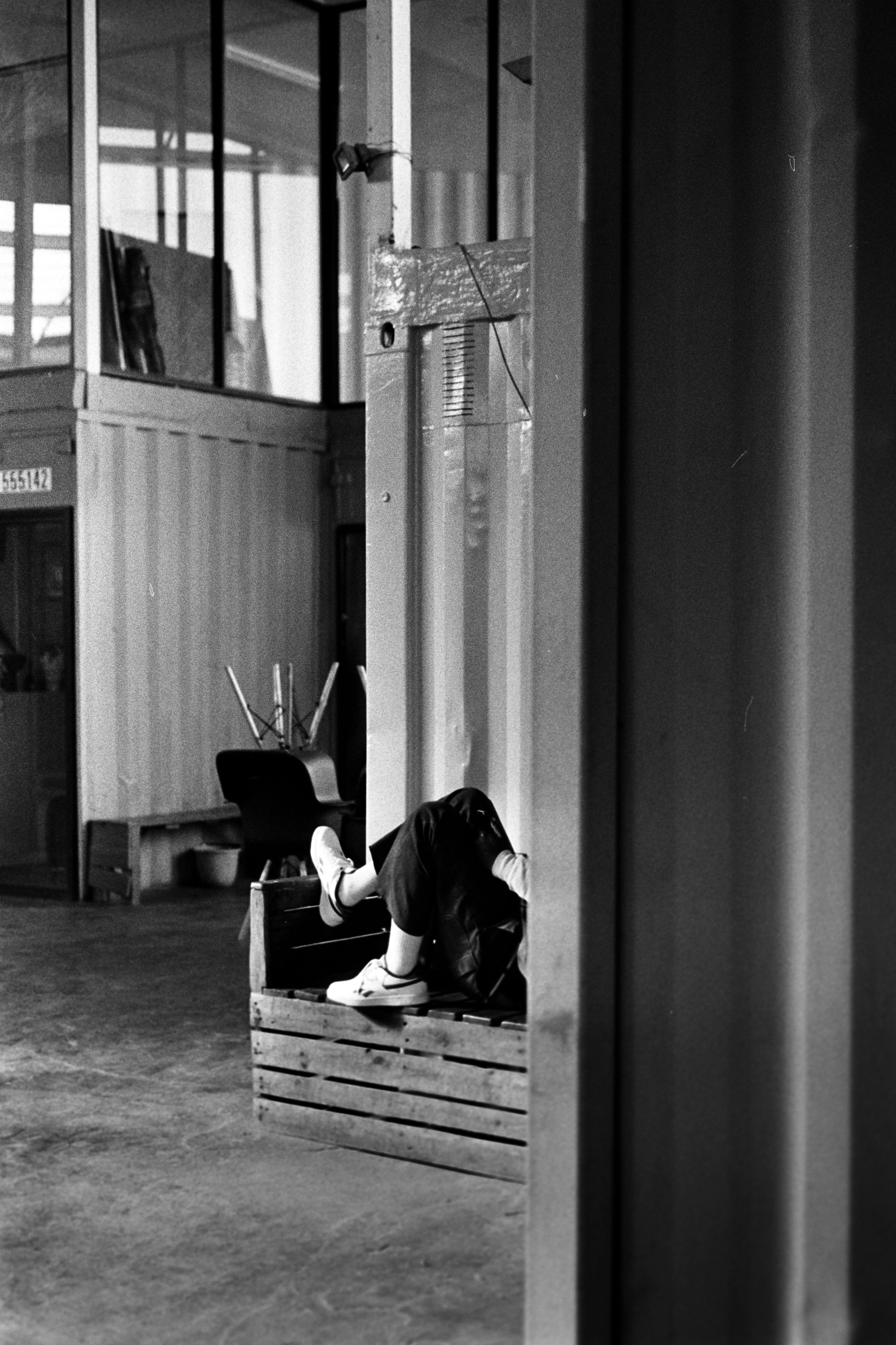 Person resting inside a modern industrial setting in Johannesburg, South Africa.