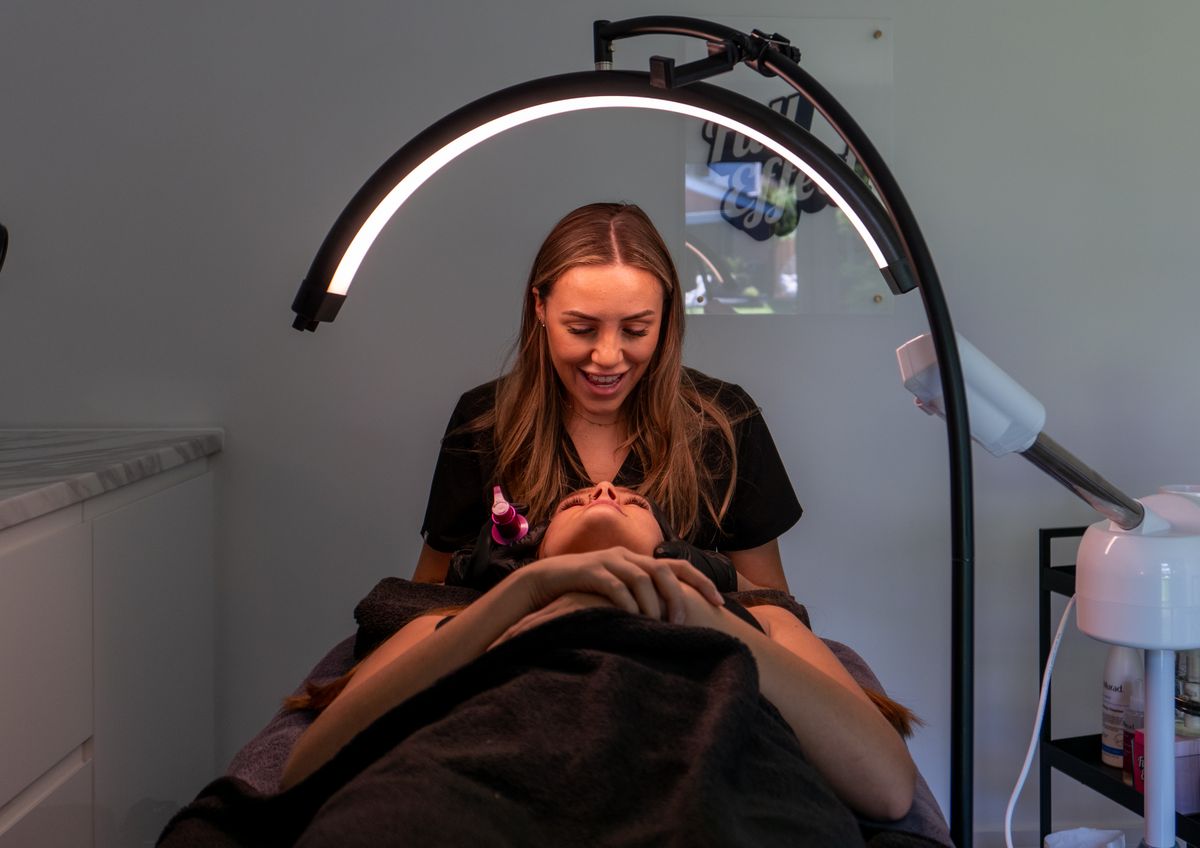 Facial treatment with skincare equipment in a beauty spa and barber shop