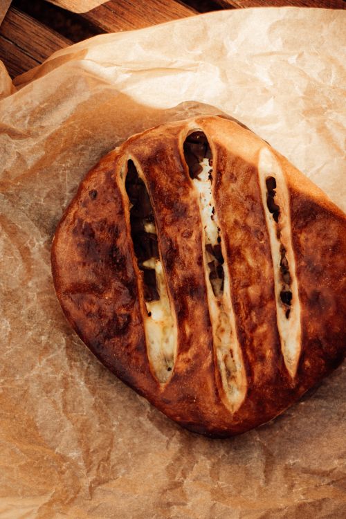 Free Delicious Georgian style homemade bread with slits, baked to a crispy golden brown perfection. Stock Photo