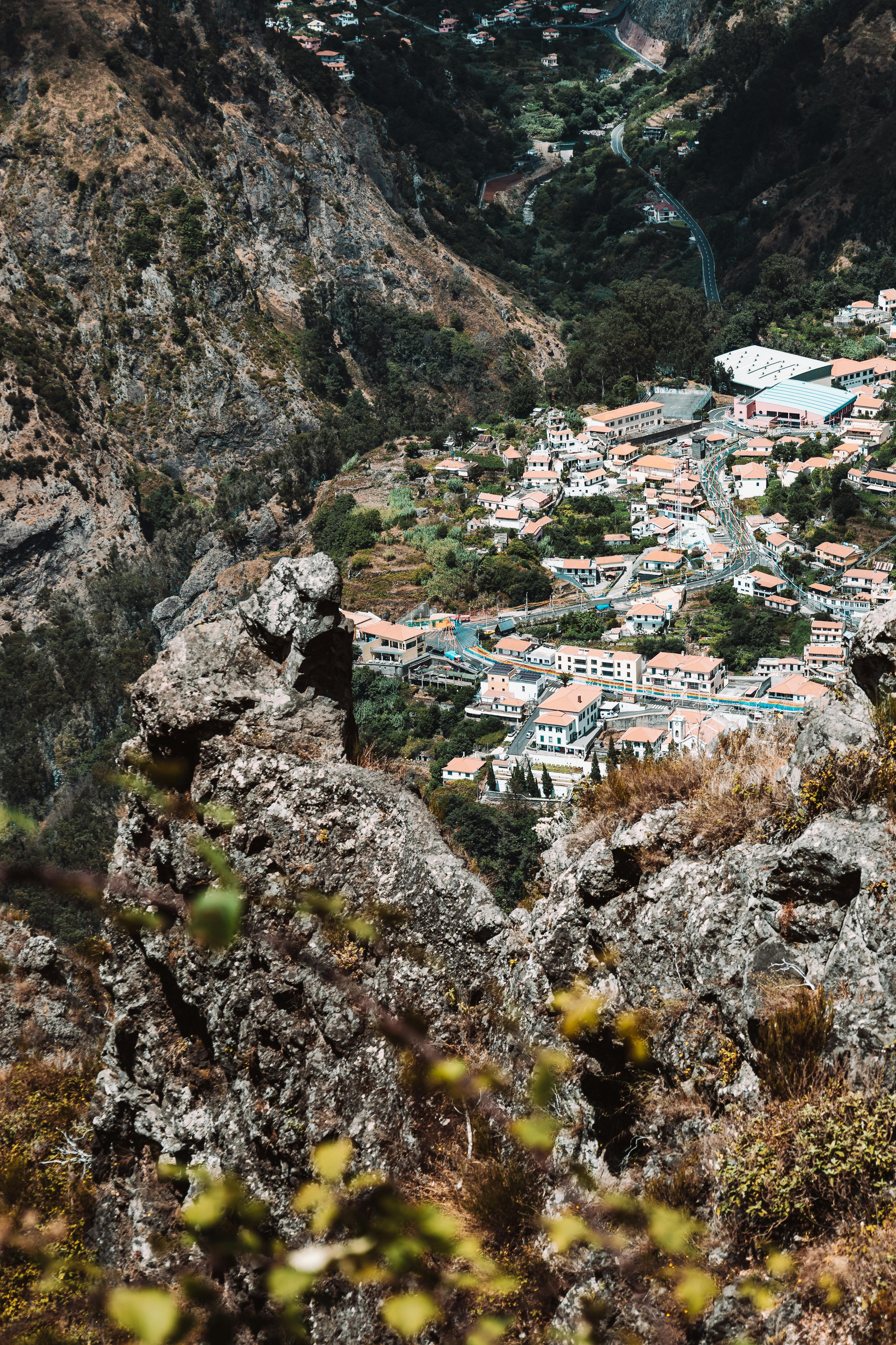 Village homes between rocky mountains in Madeira