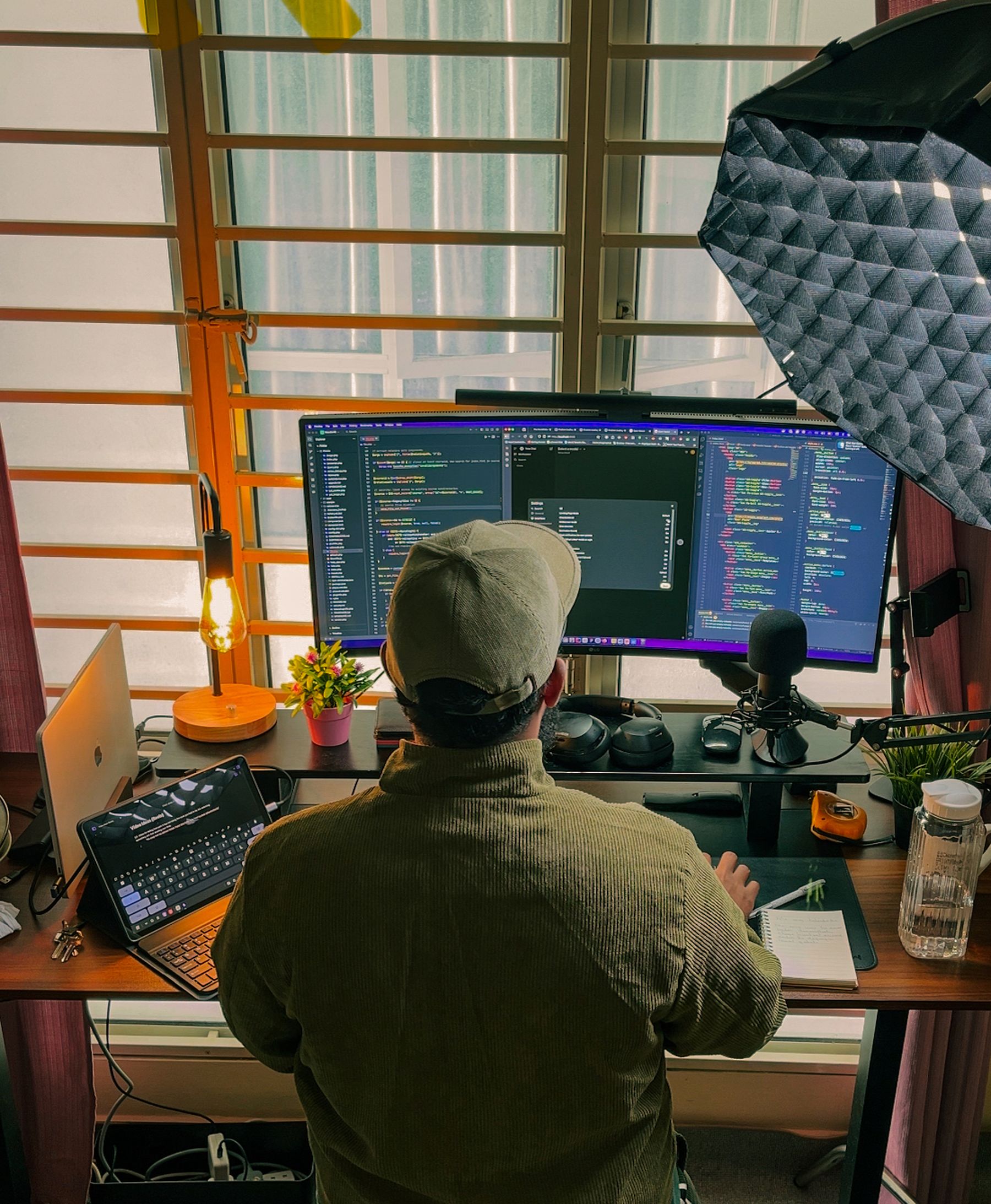 Developer working across multiple screens in remote setup