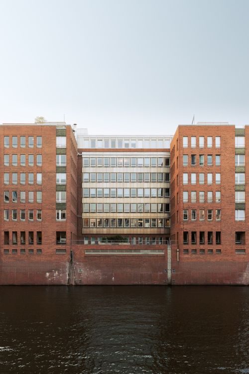 Free Symmetrical brick facade building by the water in Hamburg, Germany. Stock Photo