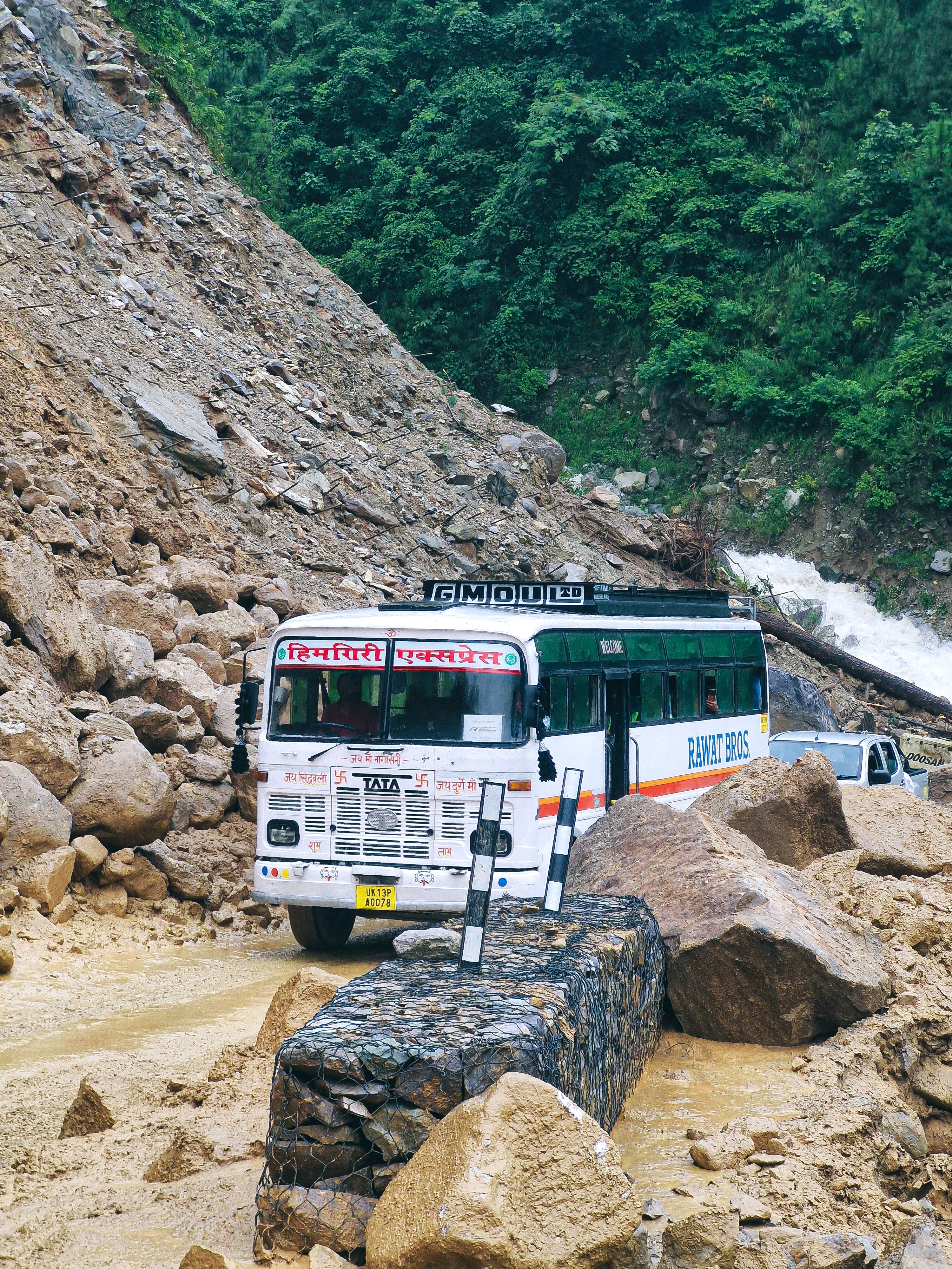 Rescue helicopter flying over remote mountain village in Nepal