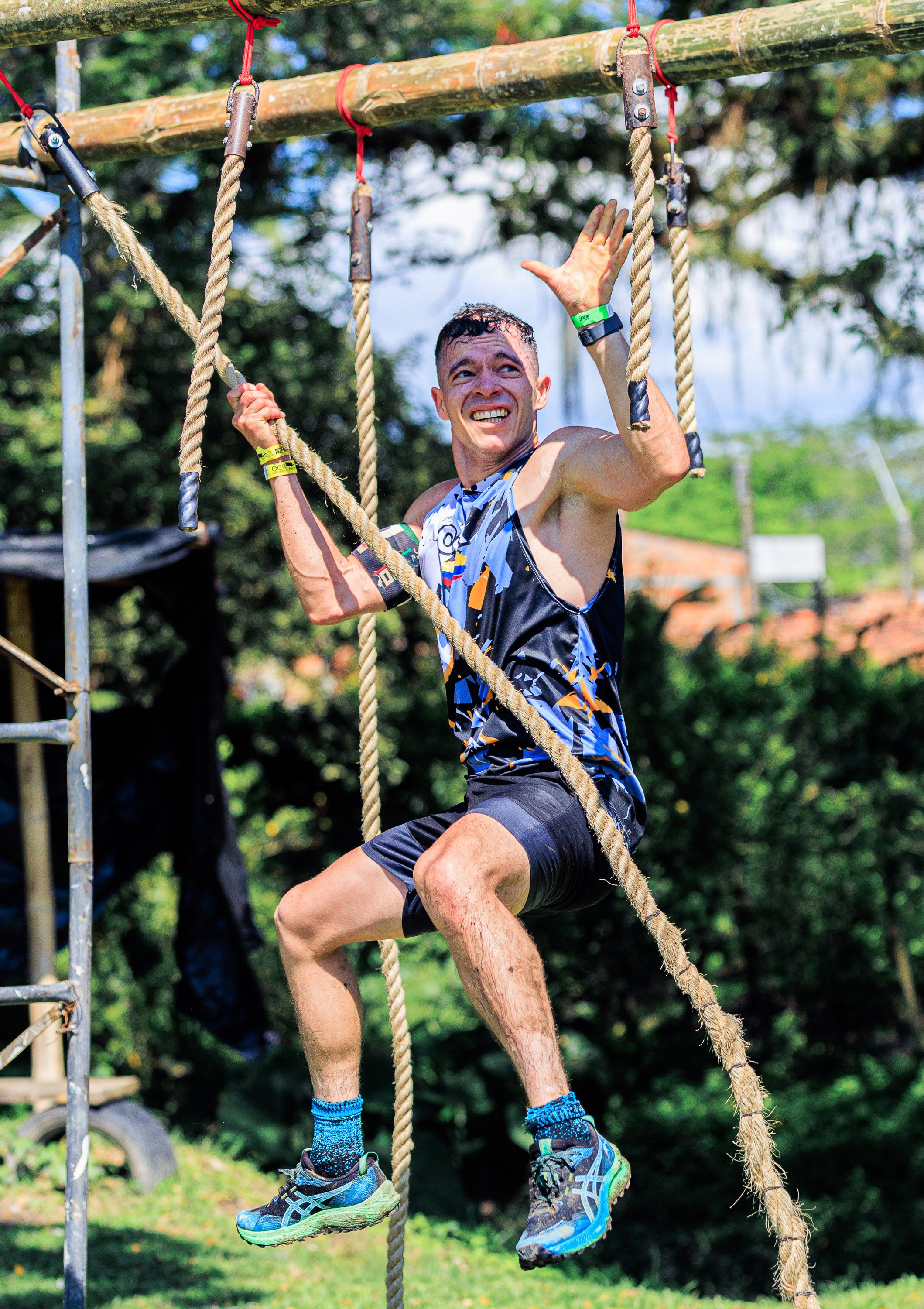 Man Climbing Rope in Outdoor Adventure Race · Free Stock Photo