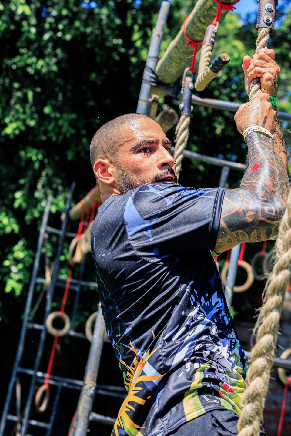 Participant negotiating an outdoor rope obstacle