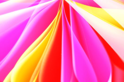 Bright and colorful folded paper creating an abstract pattern with vivid hues.