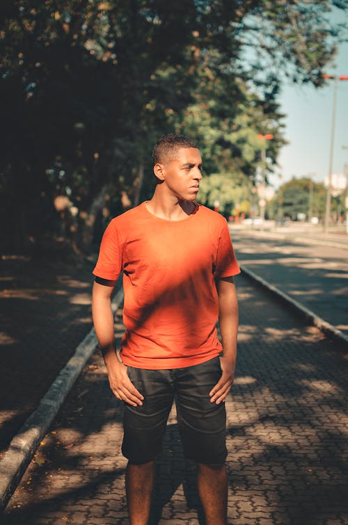 Free Photo Of Man Wearing Orange Shirt Stock Photo