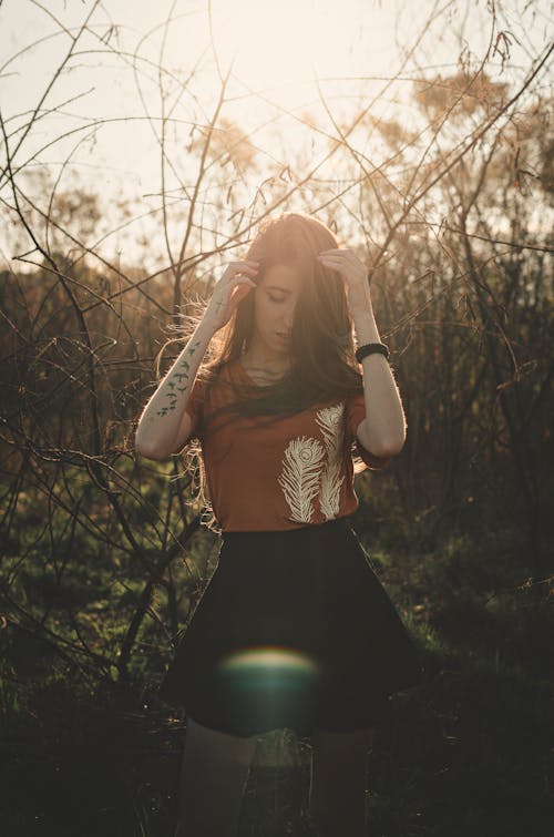 Photo Of Woman Near Tree Branches