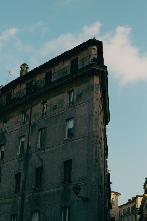 Free A classic Roman building in warm evening light showcasing timeless architecture. Stock Photo