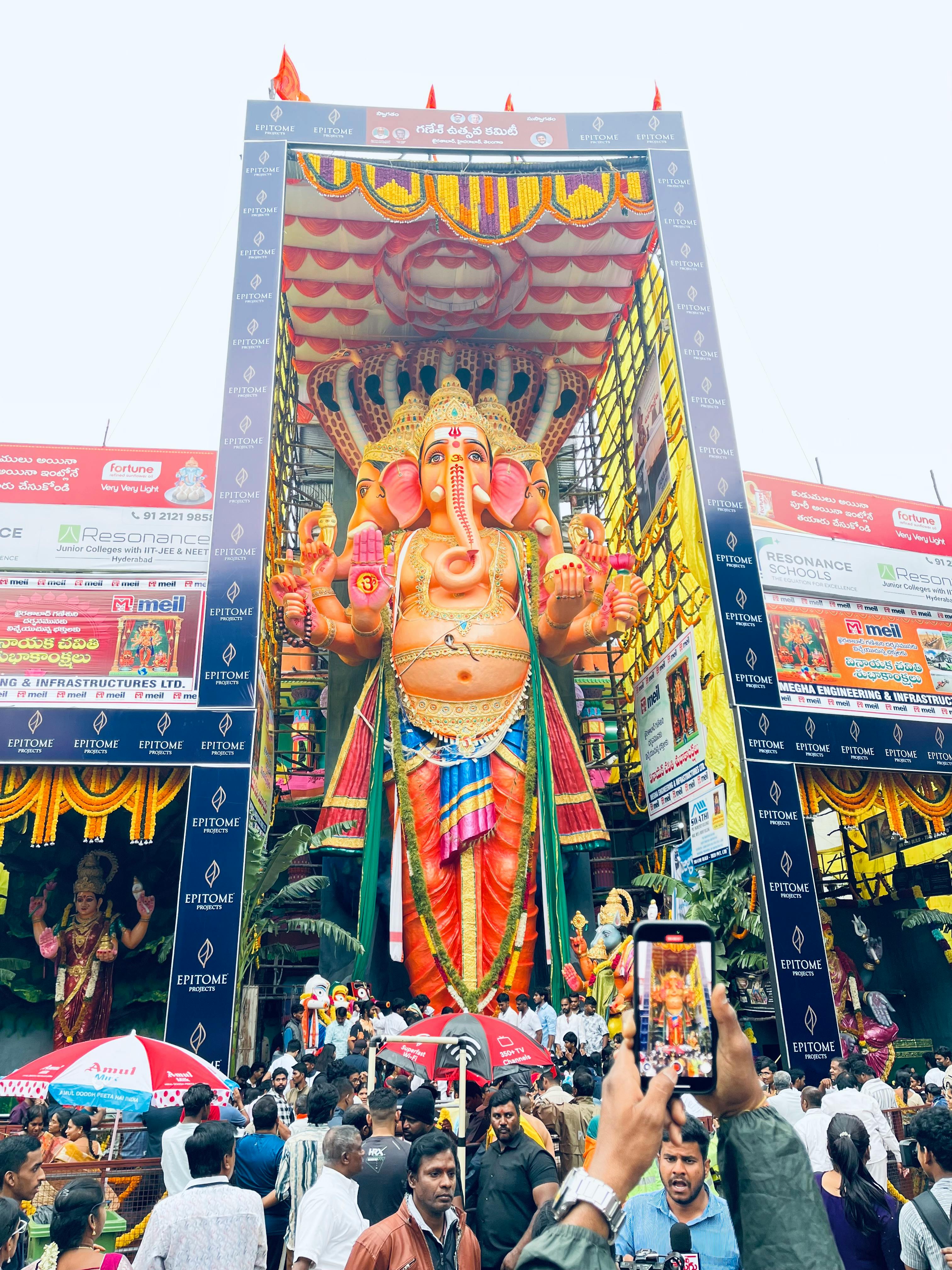 People gather around a colossal Ganesh idol during festivities in India.