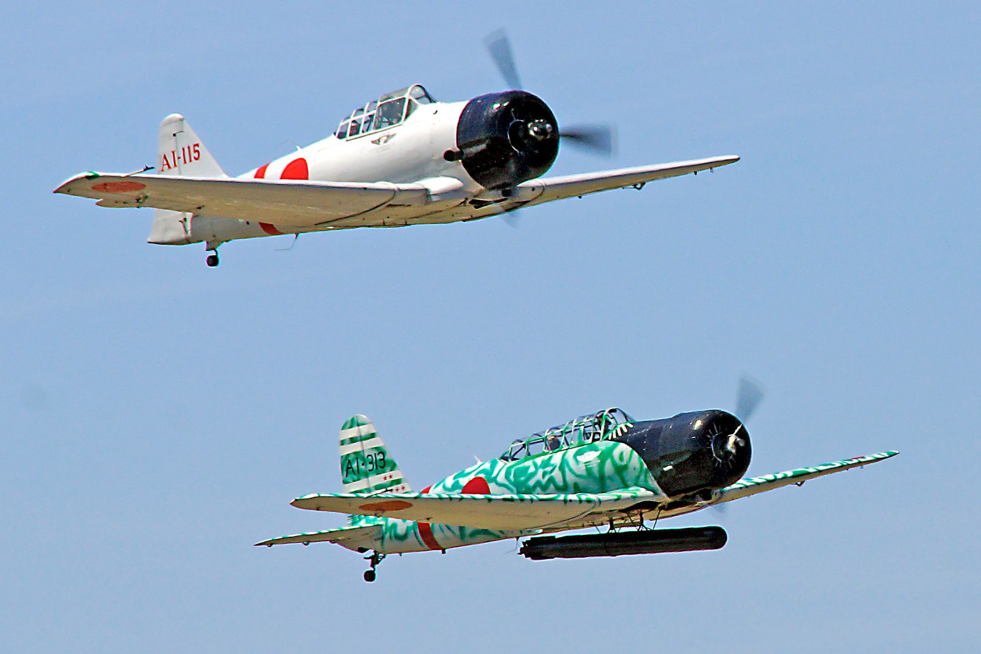 Two WW2 japanese aircraft make a photo pass at the Tico Warbird Airshow.