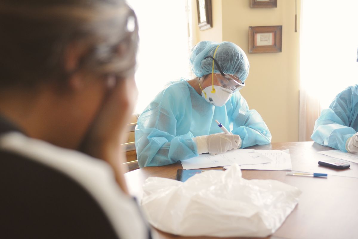 Infection prevention professionals reviewing documentation together