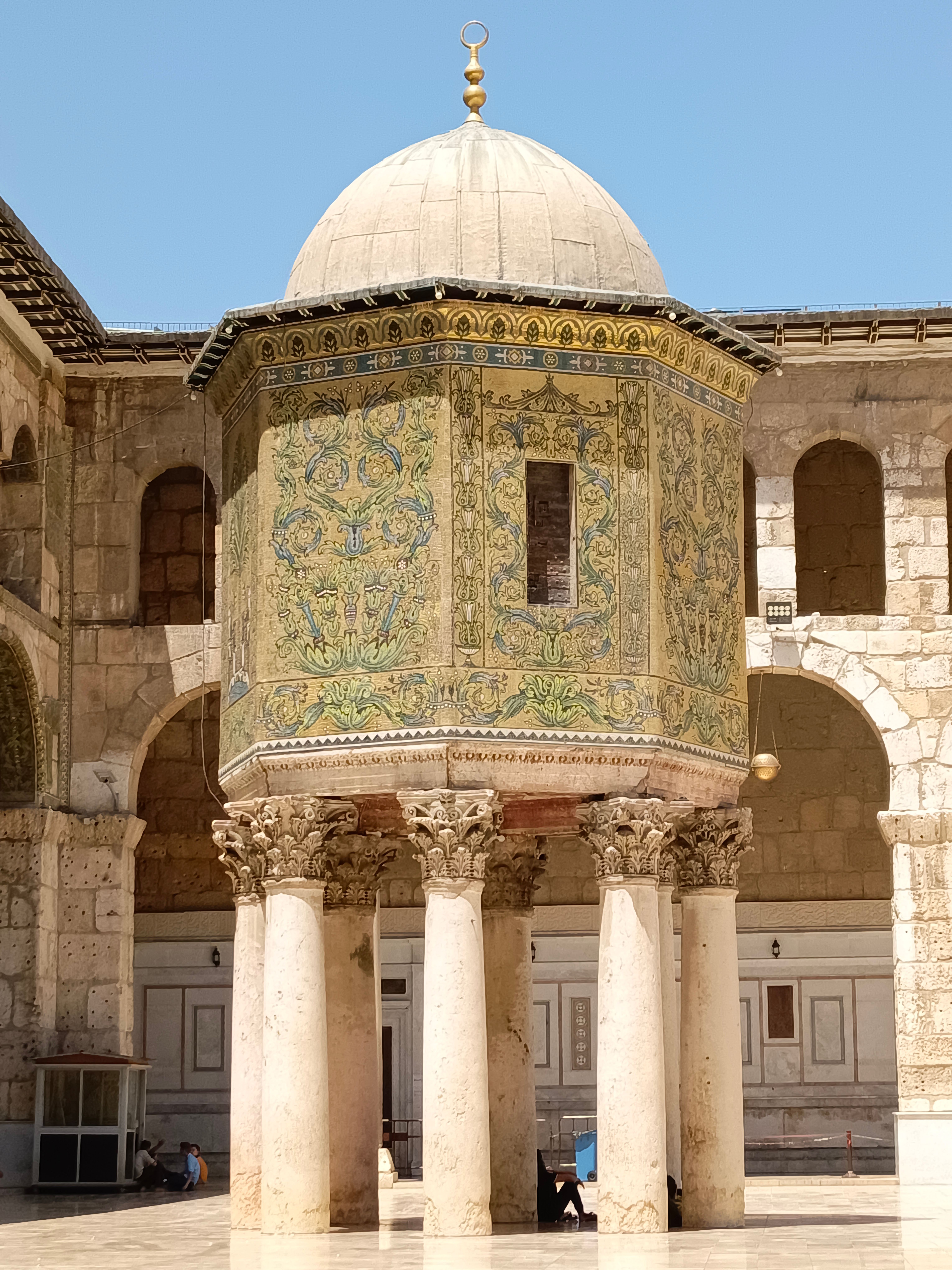 Intricate architectural details of the Umayyad Mosque in Damascus, Syria, captured on a sunny day.