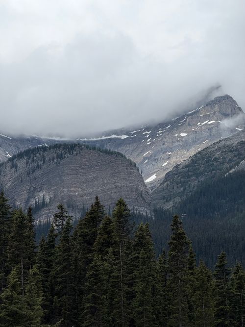 Free Stunning view of a cloud-covered mountain peak in Banff, Alberta, Canada. Stock Photo