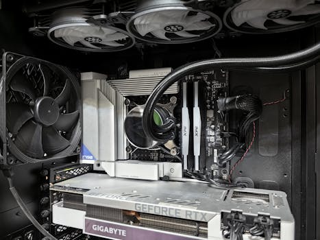 Close-up of a high-performance gaming PC build featuring a Geforce RTX graphics card and complex cooling system.