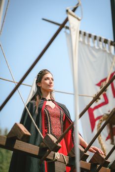 Woman in medieval costume at Santa Maria da Feira festival, Portugal.