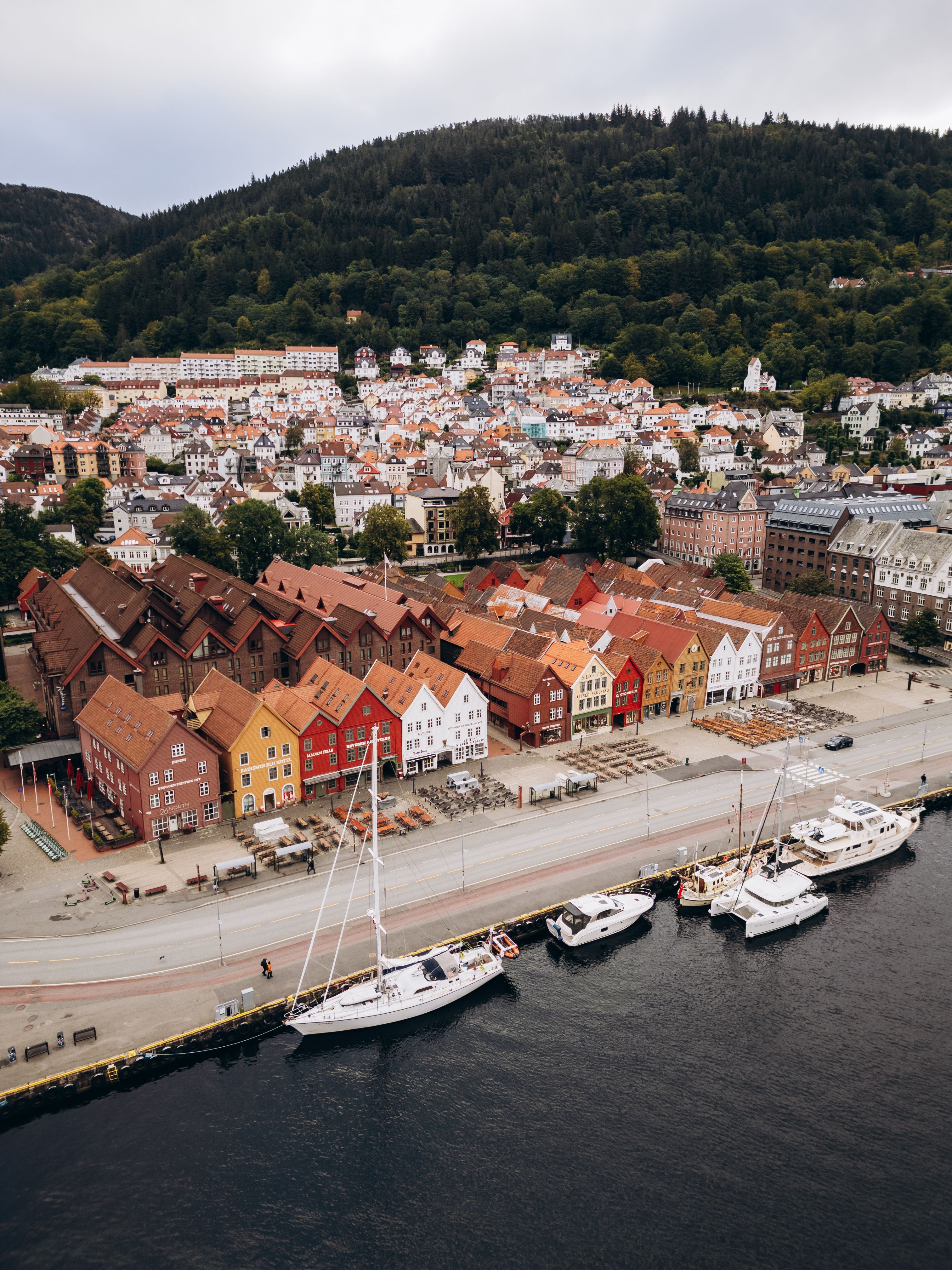 The wooden Hanseatic wharf buildings at Bryggen in Bergen seen from above the harbour.