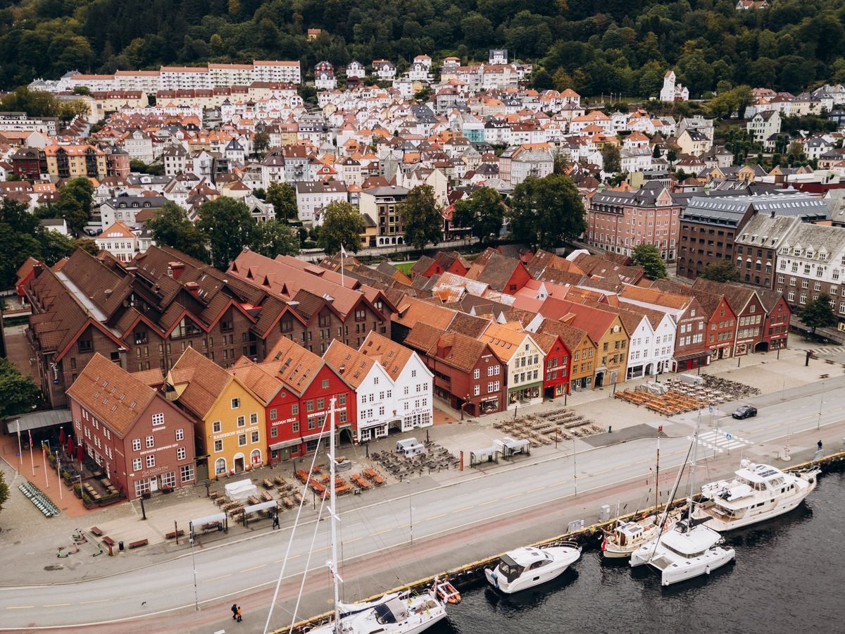 The wooden Hanseatic wharf buildings at Bryggen in Bergen seen from above the harbour.