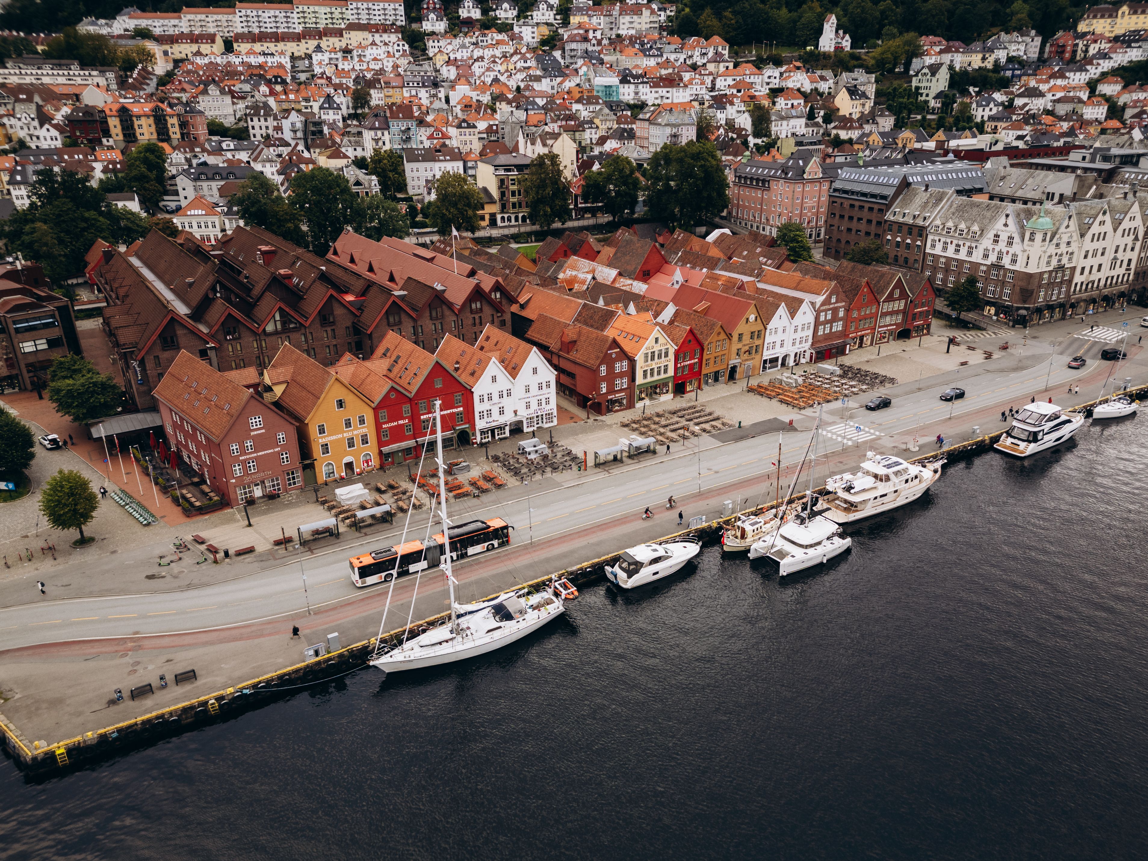 Aerial view of Bryggen Wharf in Bergen, Norway, showcasing colorful historic buildings and marina. — photo by Jonathan Borba / Pexels