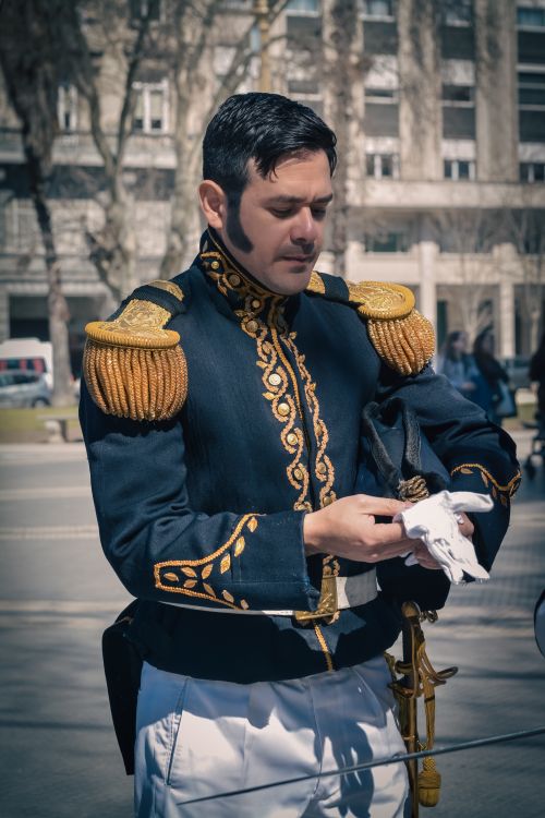 Free Man in historic military uniform during urban reenactment event, daytime. Stock Photo