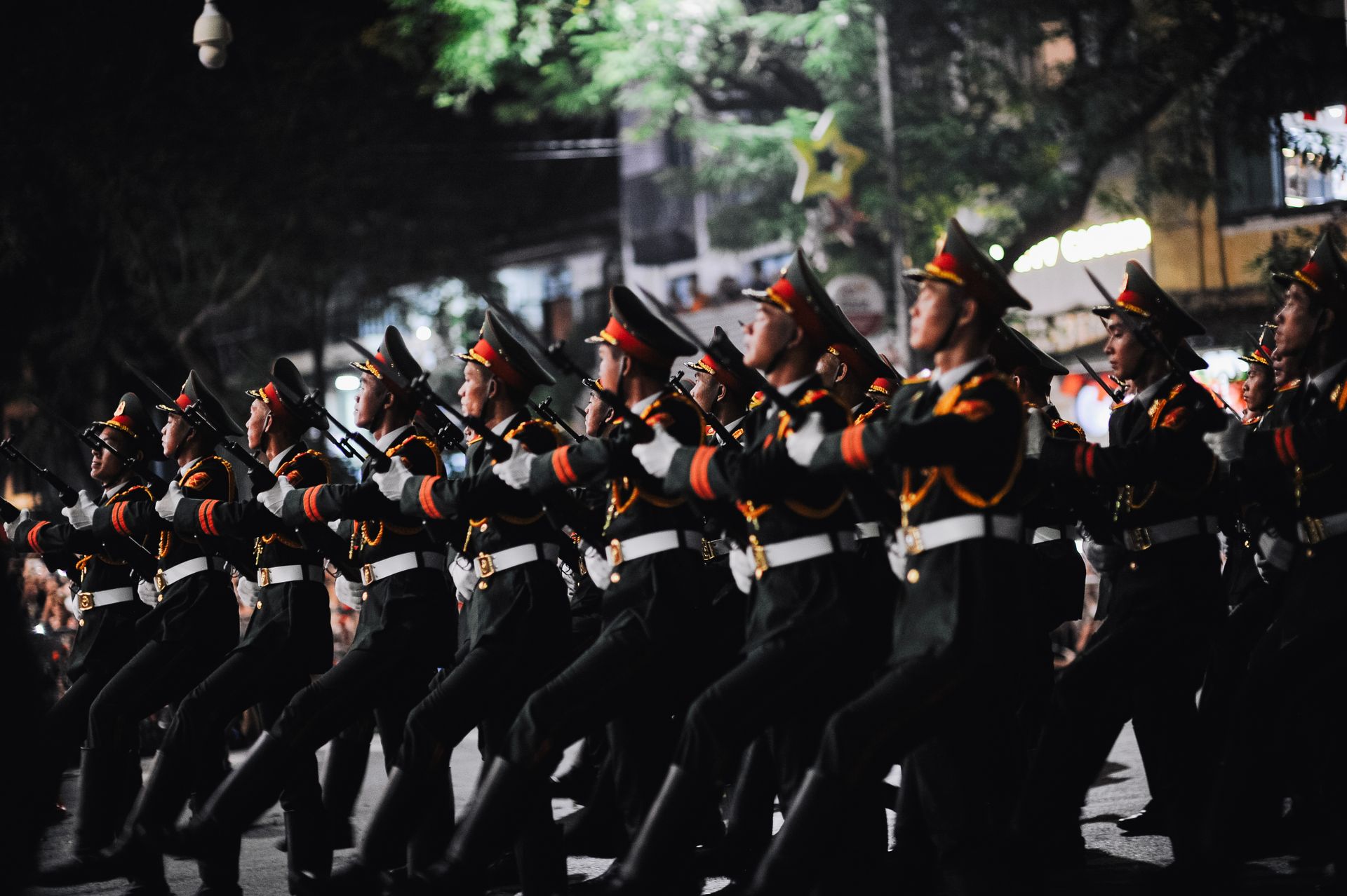 Silhouetted soldiers during a nighttime military drill