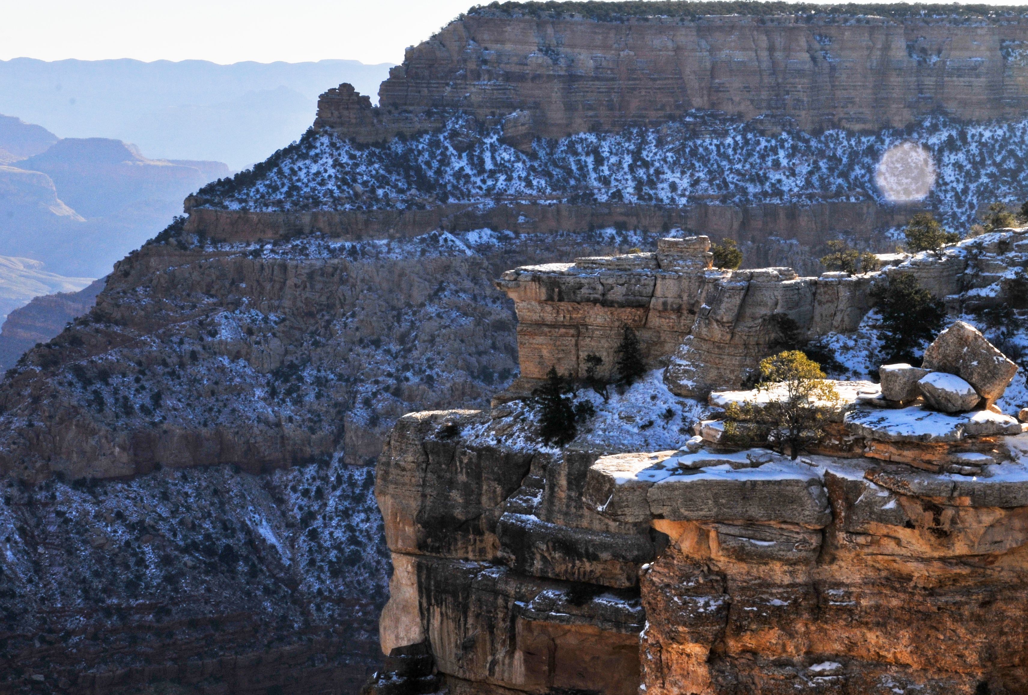 Breathtaking winter view of the snow-dusted Grand Canyon cliffs in Arizona.