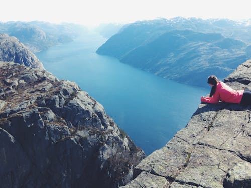 Woman Lying on Cliff