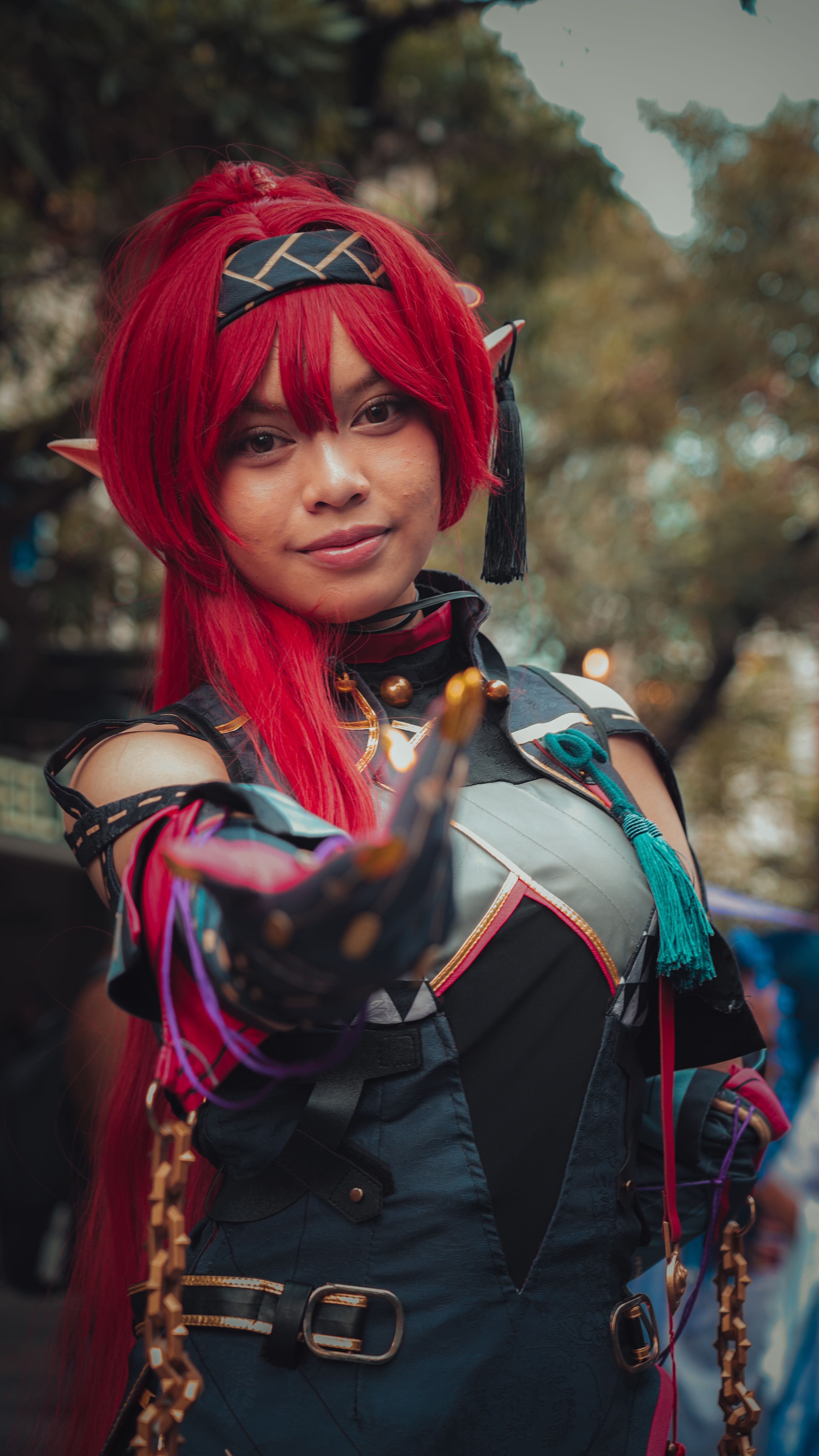 Cosplay Character with Red Hair in Park Setting