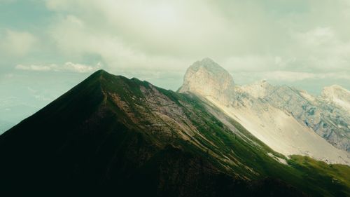 Free Captivating view of mountains with lush greenery under a cloudy sky. Stock Photo