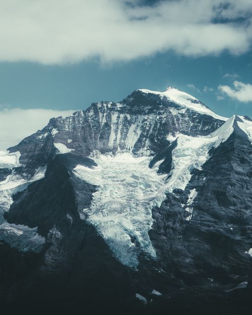 Free Stunning view of a snow-capped mountain under a clear blue sky. Stock Photo